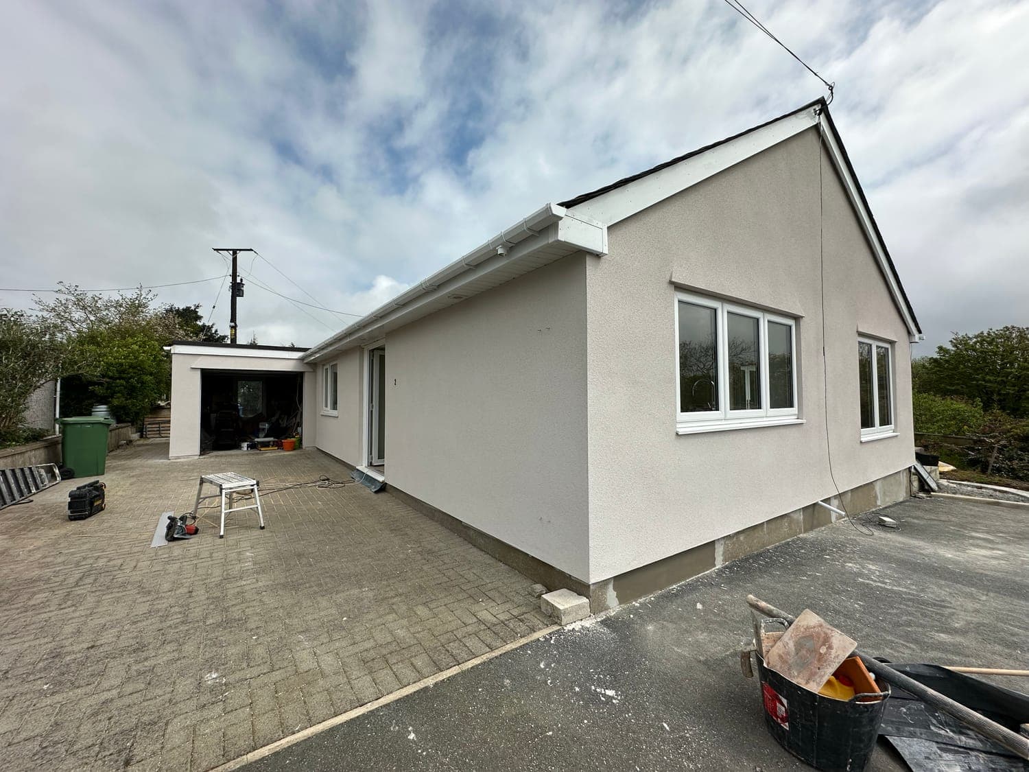 Bungalow and rear extension finished in off-white silicone render