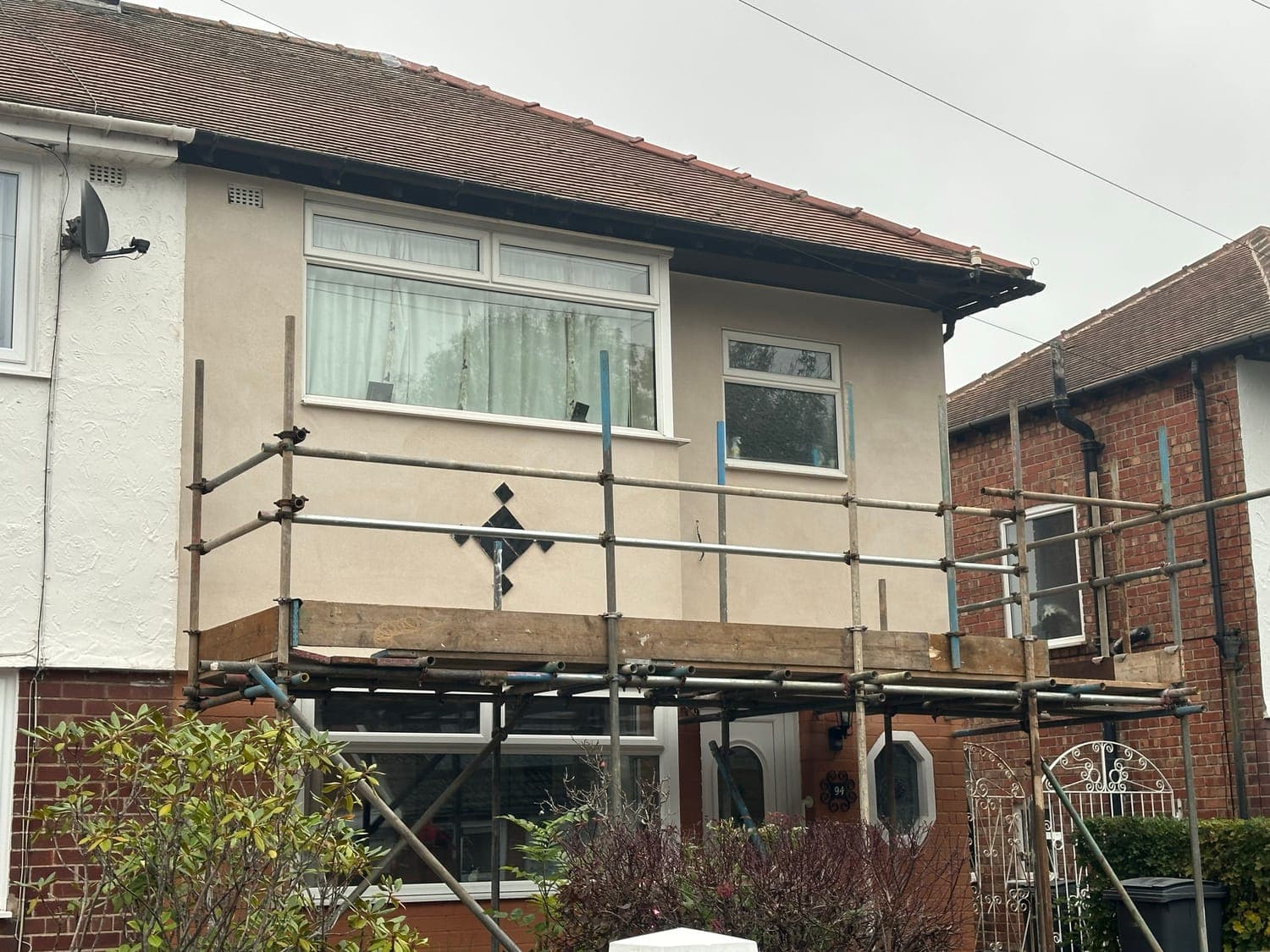 The same upper storey finished in smooth render, ready for painting