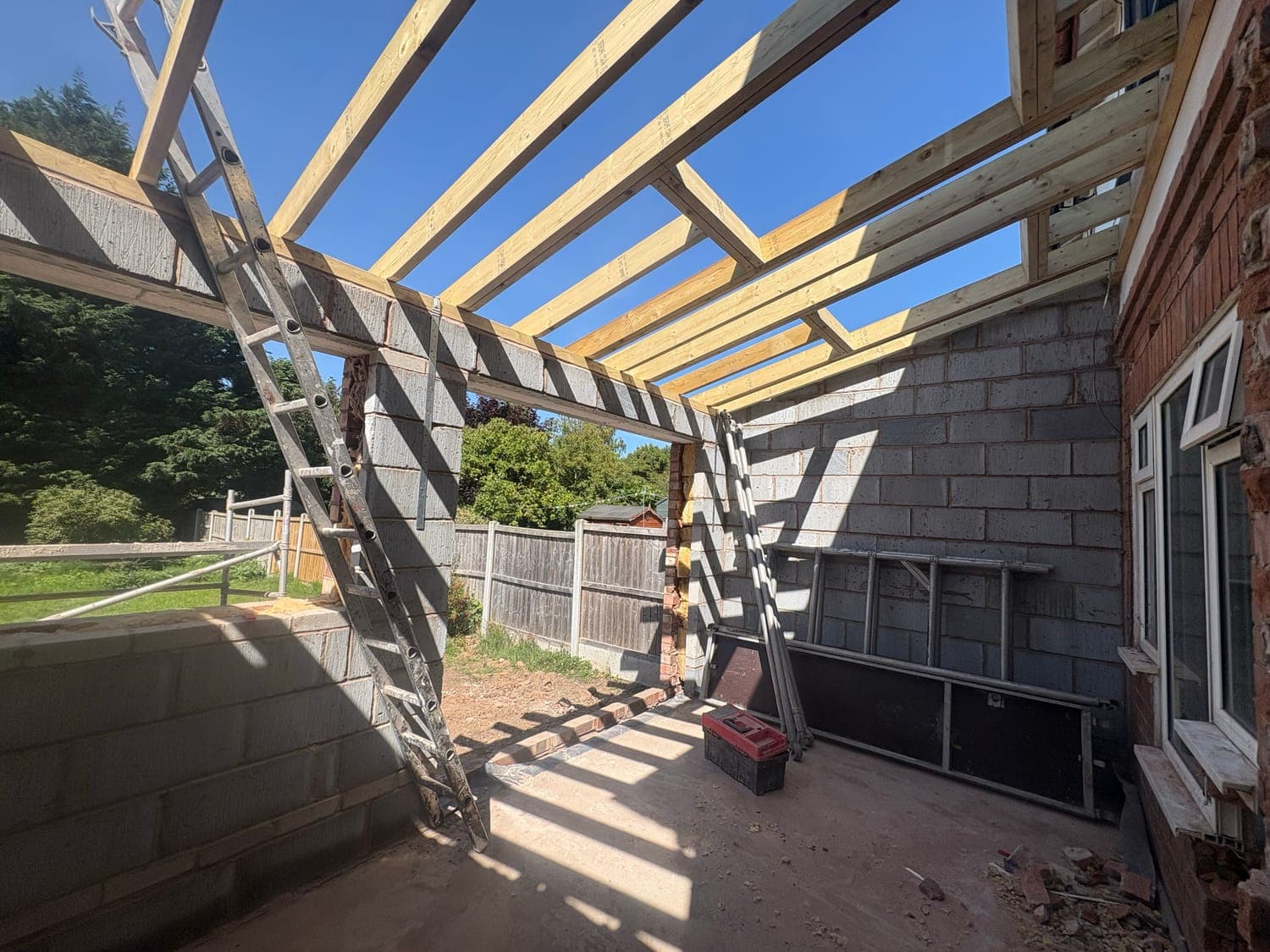 Extension in brick and blockwork with the roof timbers being set out